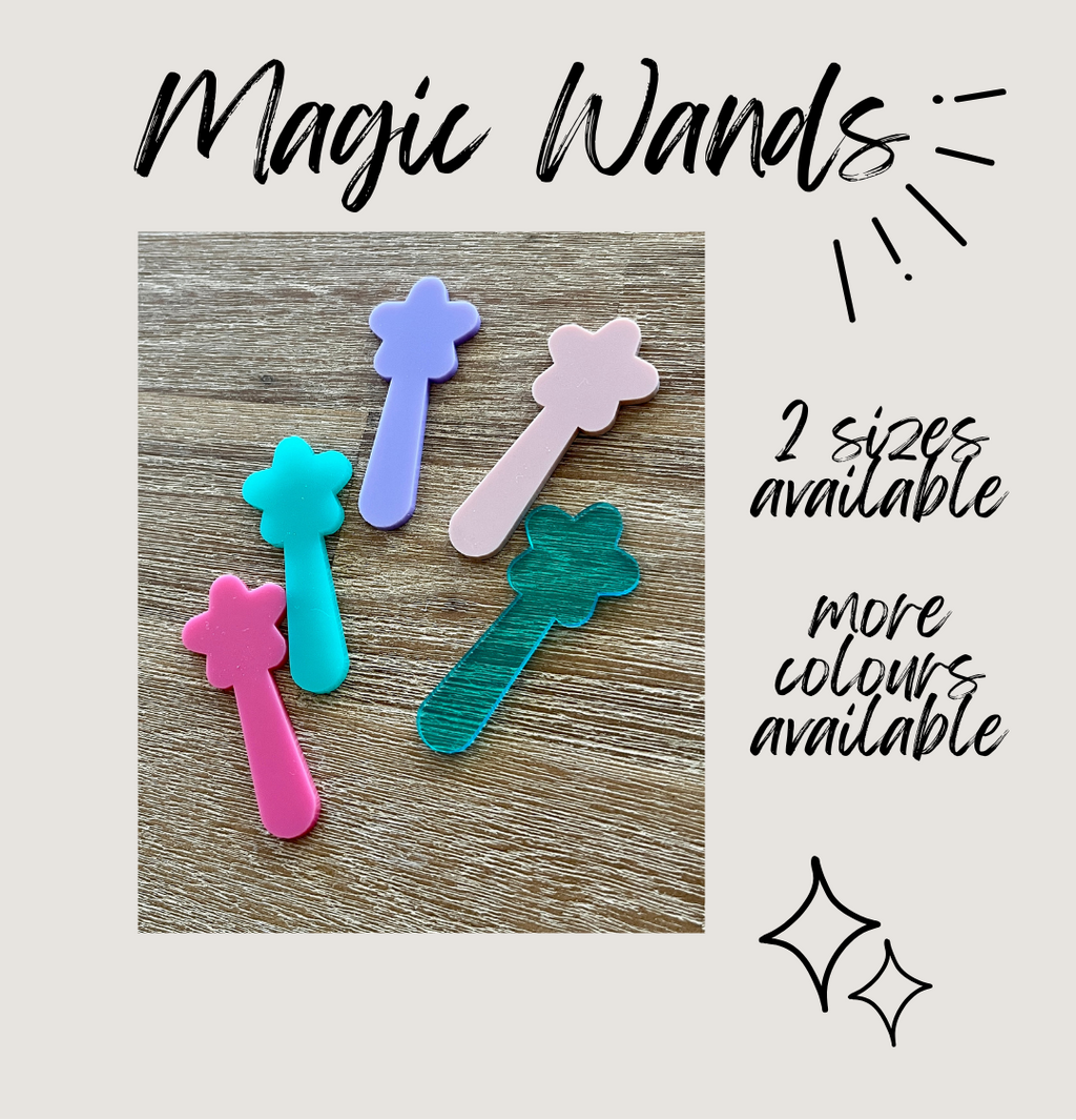Colorful magic wands on a wooden surface with text indicating sizes and color availability.