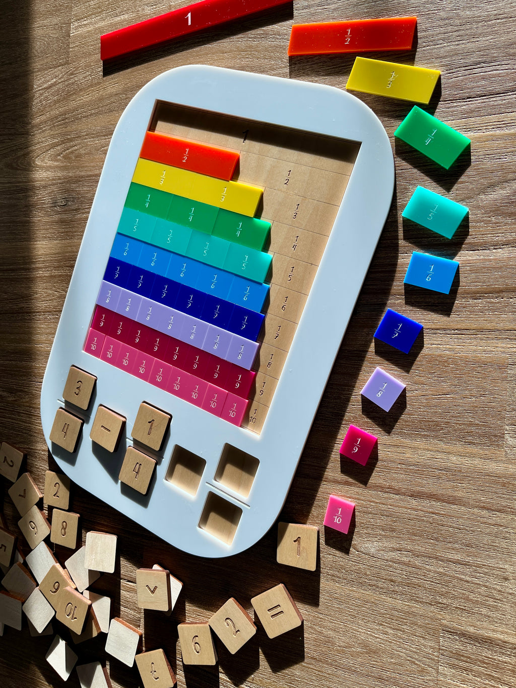 Dry Erasable Fraction Bar Tray | Large Flisat Insert displaying handcrafted colorful wood fraction bars and wooden number tiles arranged on a light wood surface, homeschool education resources.