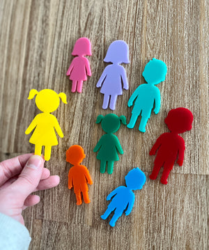 Collection of colorful translucent people shapes in various sizes displayed on a wood surface, Little Dry Erasables - People, handcrafted, homeschool, education resources.