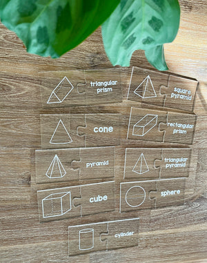 Little Dry Erasables - 2 Part Geometry 3D Shape Puzzles featuring clear interlocking pieces with white geometric shape illustrations paired with names, handcrafted homeschool education resources.