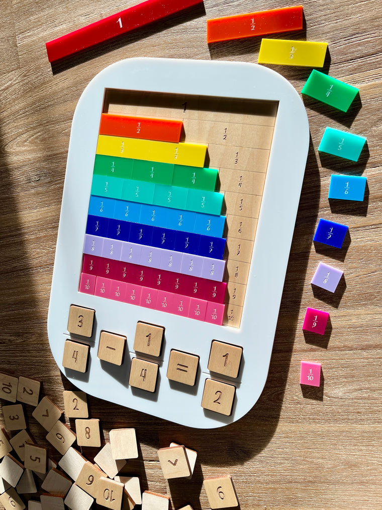 Dry Erasable Fraction Bar Tray | Large Flisat Insert featuring handcrafted colorful wooden fraction bars arranged by size inside a white tray, with wooden number tiles scattered on a wood surface, homeschool education resources.