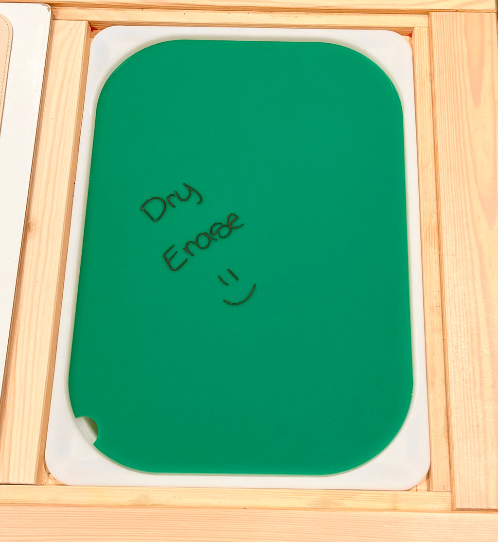Green dry erase board with rounded edges and handwritten "Dry Erase" text and smiley on a white tray background