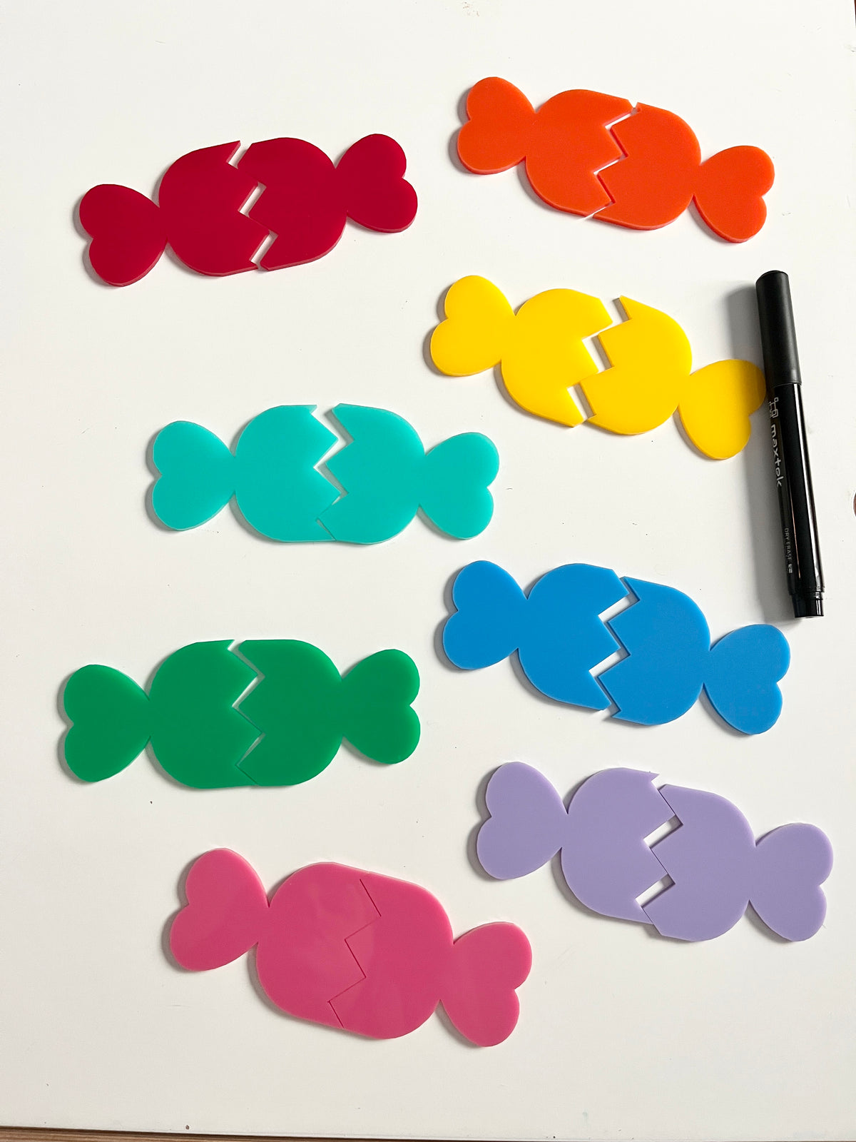 Little Dry Erasables - 2 Part Candies showcasing bright, interlocking candy-shaped pieces in vibrant colors alongside a black dry-erase marker, handcrafted homeschool education resources.