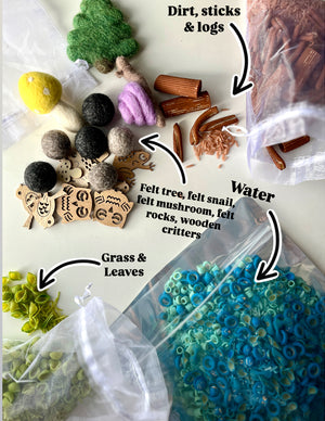 Assorted natural play materials including felt trees, wooden animals, felt balls, plastic sticks, green leaves, and blue ring beads in bags