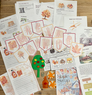 Digital Download | Maple Syrup Unit Study showcasing printable pages with maple syrup facts, vocabulary, recipes, educational cutouts of bottles, leaves, and trees arranged on a wooden surface, handcrafted homeschool education resources.