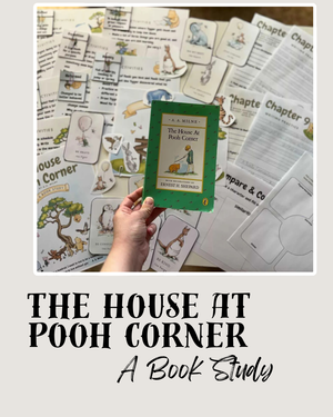 Hand holding a classic copy of The House at Pooh Corner surrounded by illustrated study guides, chapter worksheets, and character flashcards for Digital Download or Print & Bound - The House at Pooh Corner Book Study, handcrafted homeschool education resources.