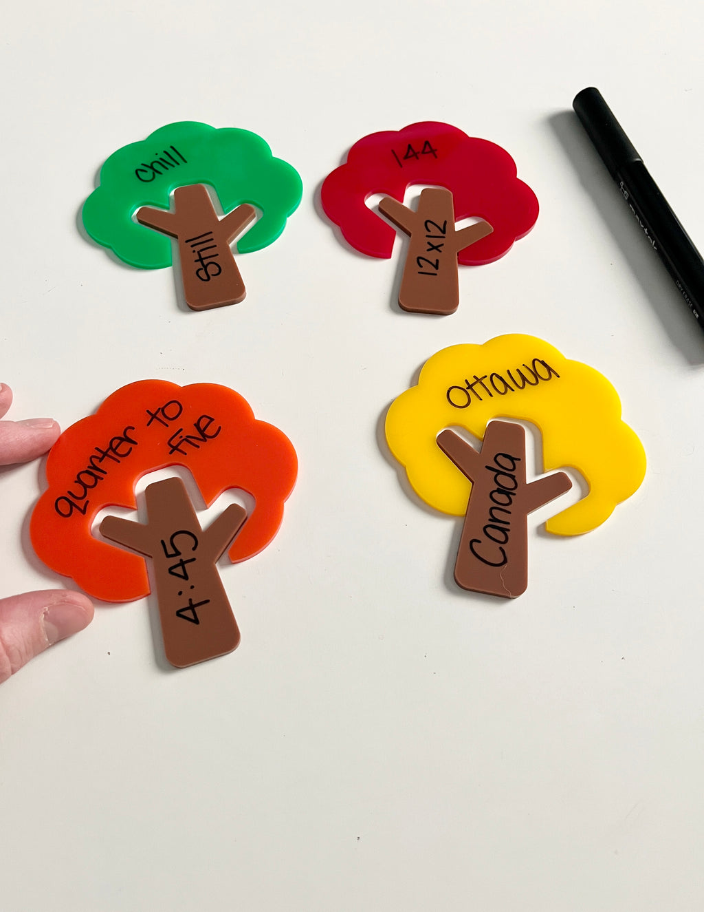 Little Dry Erasables — Trees and Tree Trunks — Colours of Fall; Medium Version showing colorful tree shapes in green, red, orange, and yellow with handwritten words and numbers, black dry-erase marker, handcrafted homeschool education resources.