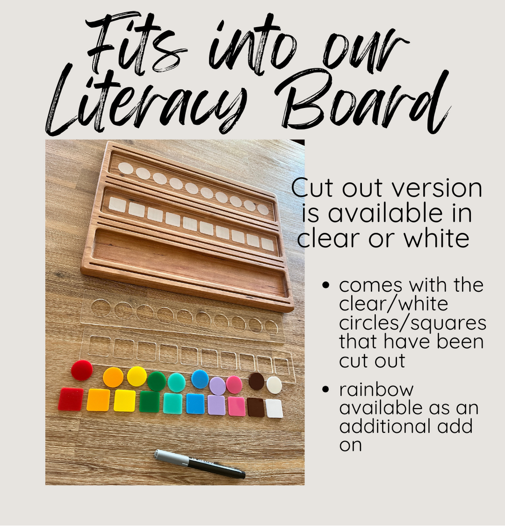 Wooden literacy board with cut-out circles/squares and a pen on a wooden surface.