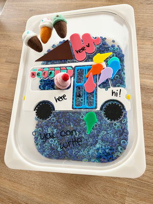 Dry Erasable Ice Cream Truck Flisat Table Bin Lid filled with blue sensory beads, colorful felt ice cream cones, and dry erase marker writing space, handcrafted, homeschool, education resources.