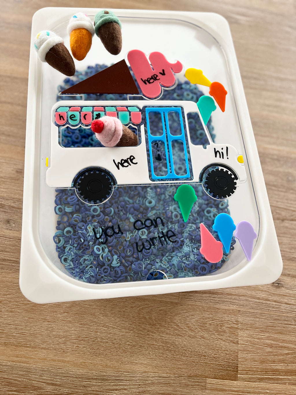 Dry Erasable Ice Cream Truck Flisat Table Bin Lid featuring colorful felt ice cream cones, writable surfaces with dry erase markers, blue sensory fillers, handcrafted, homeschool, education resources.