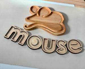Wooden mouse-shaped sensory tray with matching wooden letters spelling mouse on white surface
