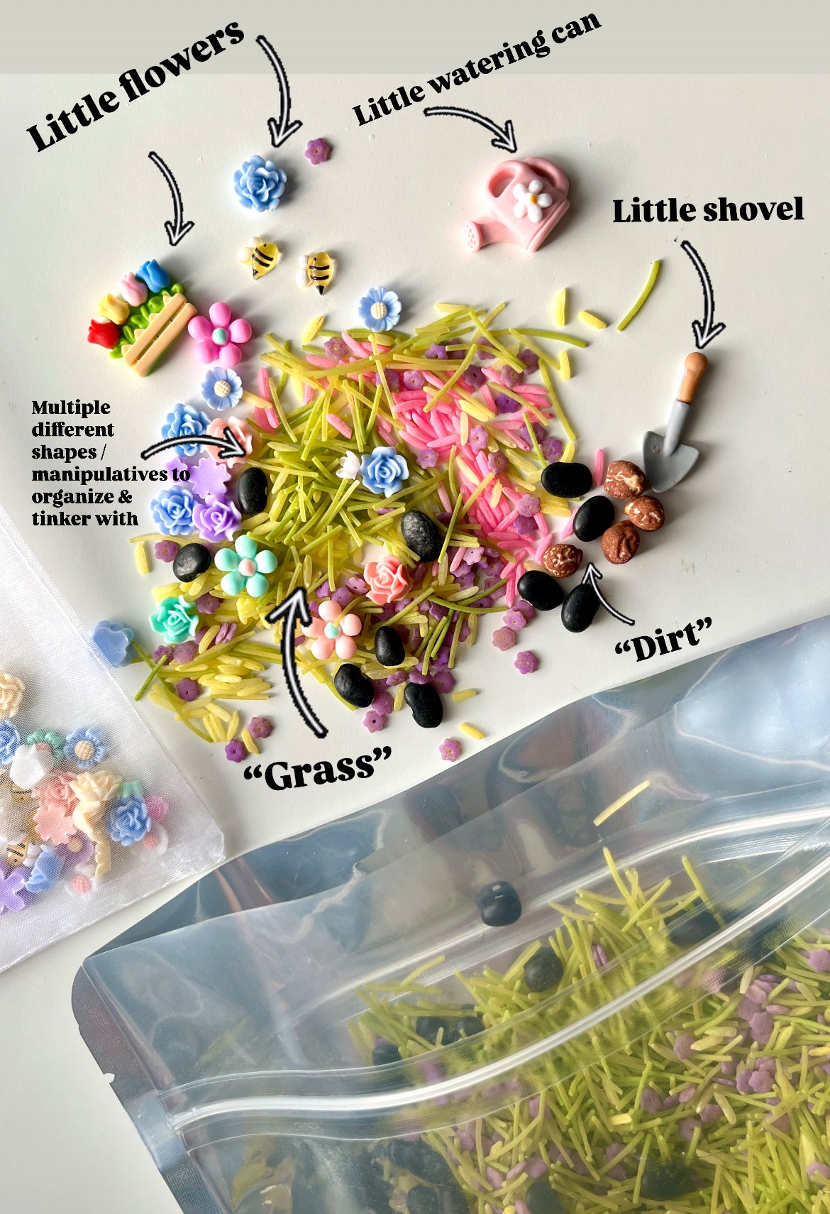 Miniature gardening set with tiny flowers, watering can, shovel, colorful grass pieces, and small black and brown “dirt” beads