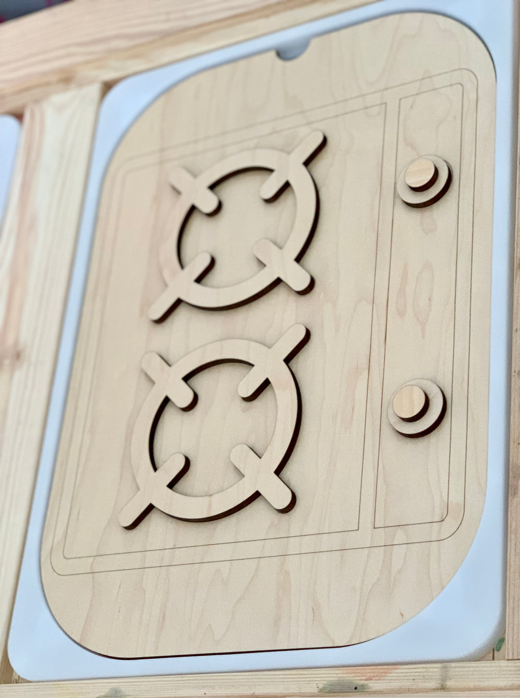 Wooden stove top insert with two burners and turnable knobs made from maple plywood and acrylic
