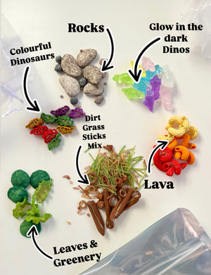 Small colorful dinosaur figures, rocks, glow-in-the-dark dinos, faux leaves, grass, sticks, and orange lava pieces on white background