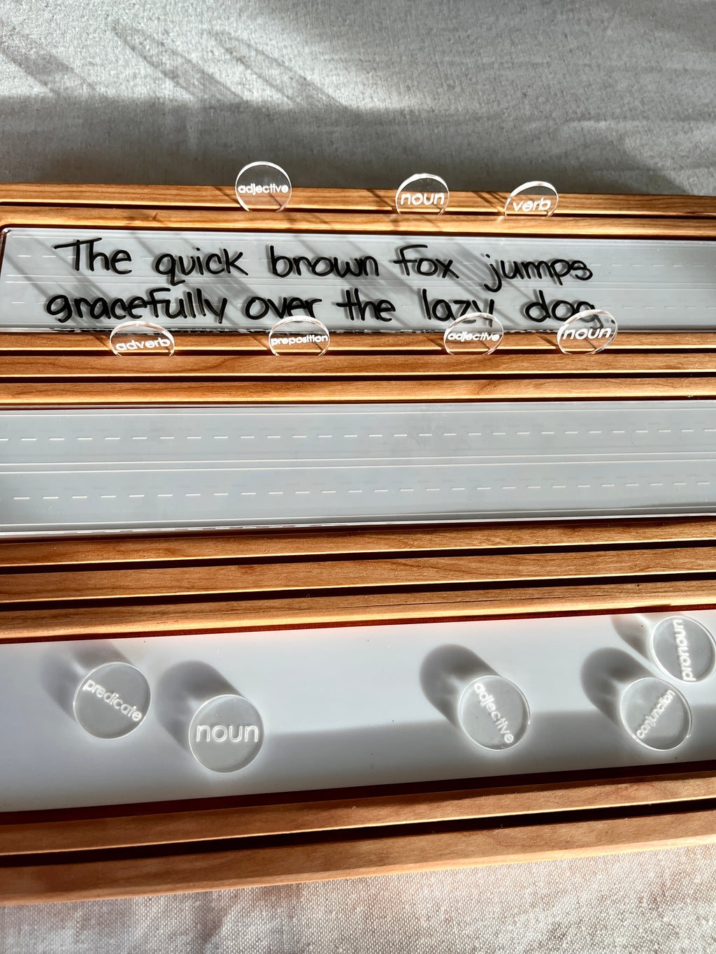 Wooden Sentence & Learning Tray | Open Ended Literacy Board | Math & Play featuring a handcrafted wood tray with clear dry-erase panel, labeled word tokens, and handwritten sentence, unique homeschool educational resources.