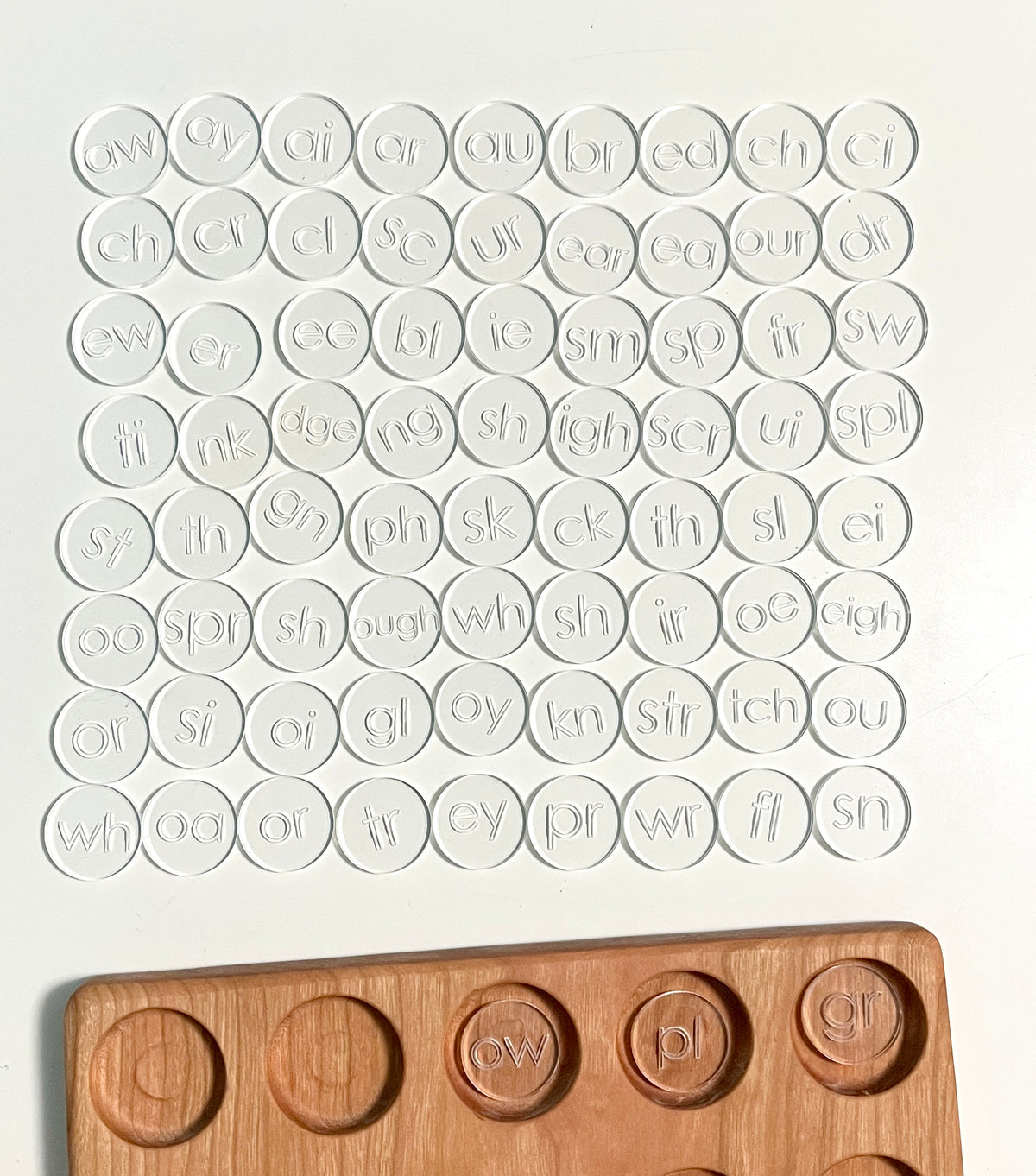Mini Wood or Clear Acrylic Discs | Set of 75 Blends and Digraphs featuring clear acrylic discs with engraved blends and digraphs arranged above a handcrafted wood tray, unique homeschool education resources.