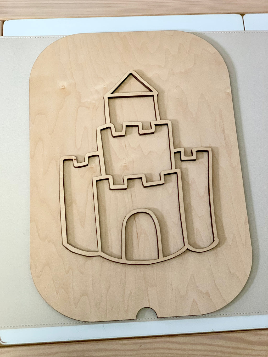 Maple plywood Fillable Castle Flisat table top insert with castle cutout design on light wood surface