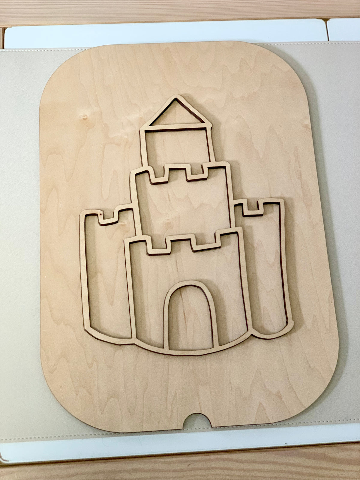 Maple plywood Fillable Castle Flisat table top insert with castle cutout design on light wood surface