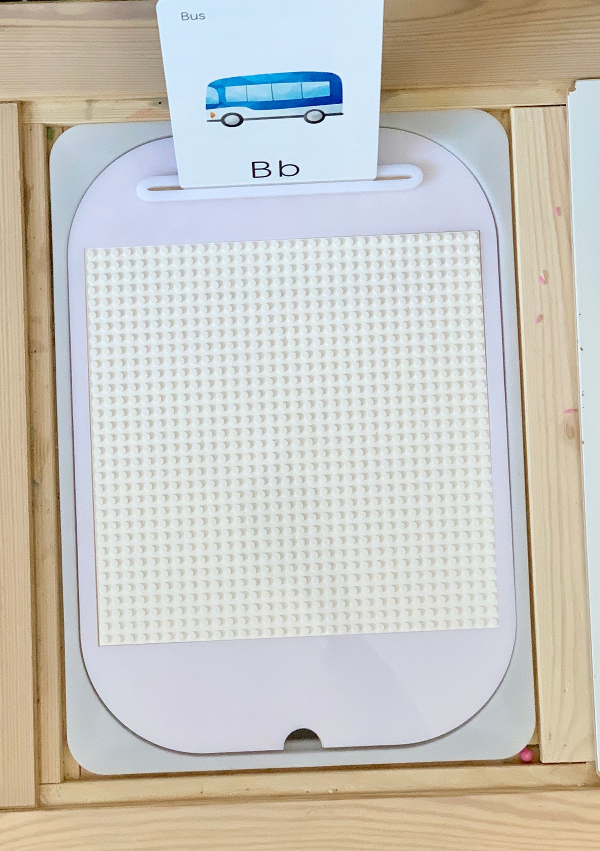 White dry erasable Flisat table top insert with Lego-compatible surface and wooden tray background