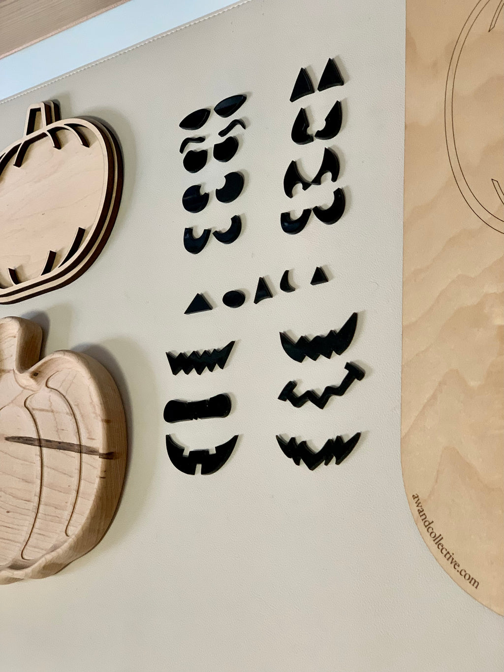 Laser cut jack o lantern facial features including eyes, noses, and mouths for pumpkin sensory play trays and inserts