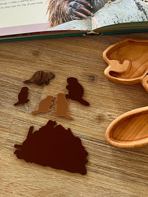 Little Dry Erasables - Beavers with Dam featuring handcrafted wooden beaver silhouettes and dam shape, displayed with a wooden tray and nature book, homeschool education resources.