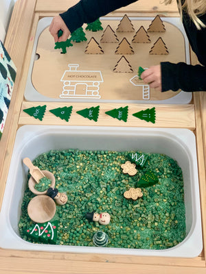 Wooden Flisat bin insert with plantable wooden Christmas trees, green sensory fill, wooden scoops, and festive figures