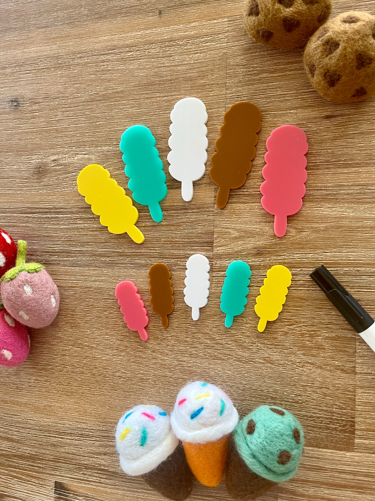 Little Dry Erasables - Popsicles Style 2 featuring handcrafted wood and acrylic popsicle shapes in bright colors arranged on a wood surface with felt food toys and a black dry erase marker, homeschool education resources.
