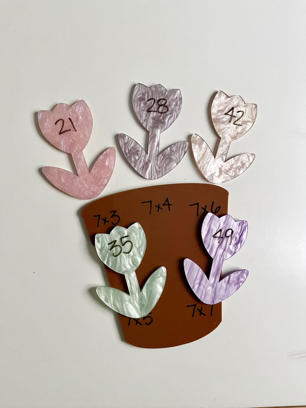 Little Dry Erasables - Large Pot with Marble Flowers featuring pastel-colored flower shapes with multiplication facts, a terracotta pot, handcrafted homeschool educational resources for interactive math learning.
