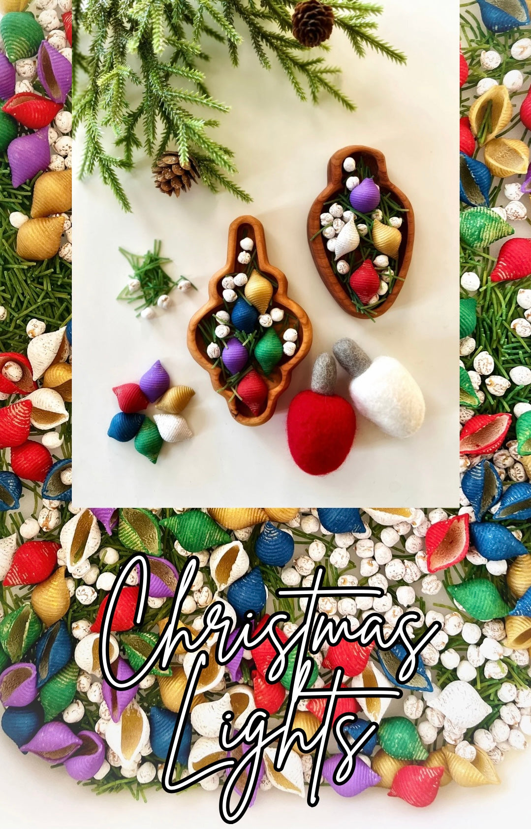 Two wooden trays filled with colorful shell-shaped ornaments, white berries, pine sprigs, and felt decor on white surface
