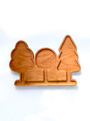 Light brown wooden serving tray with three tree-shaped compartments on a white background