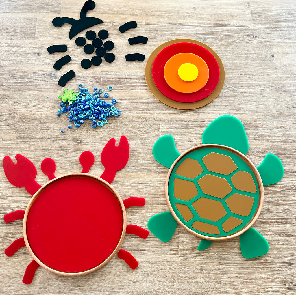 Large Circle Tray with Dry Erase Inserts / Basic Shape Plate featuring colorful layered target shape, red crab, and green turtle with natural wood frame on a wood surface, handcrafted, homeschool, education resources.