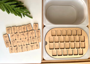 Maple wood ASL puzzle pieces with American Sign Language hand symbols and alphabet blocks in a Flisat table insert