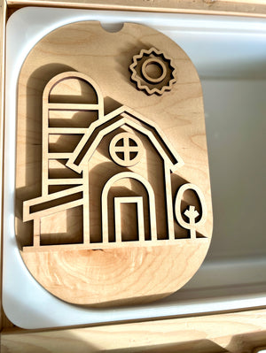 Light wooden puzzle board featuring a barn, silo, tree, and sun cutout shapes on a light surface