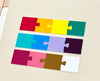 Three sets of four connected jigsaw puzzle pieces in bright red, orange, yellow, teal, blue, purple, pink, brown, and white on a white surface