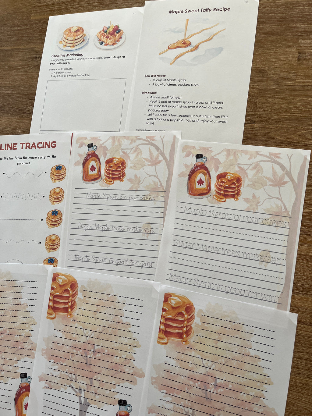 Digital Download | Maple Syrup Unit Study featuring printable educational pages with handwriting practice, maple syrup recipes, and tracing activities on a wooden table, handcrafted homeschool education resources.