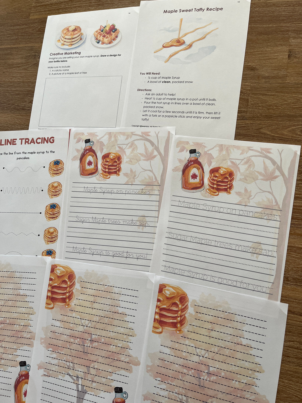 Digital Download | Maple Syrup Unit Study featuring printable educational pages with handwriting practice, maple syrup recipes, and tracing activities on a wooden table, handcrafted homeschool education resources.