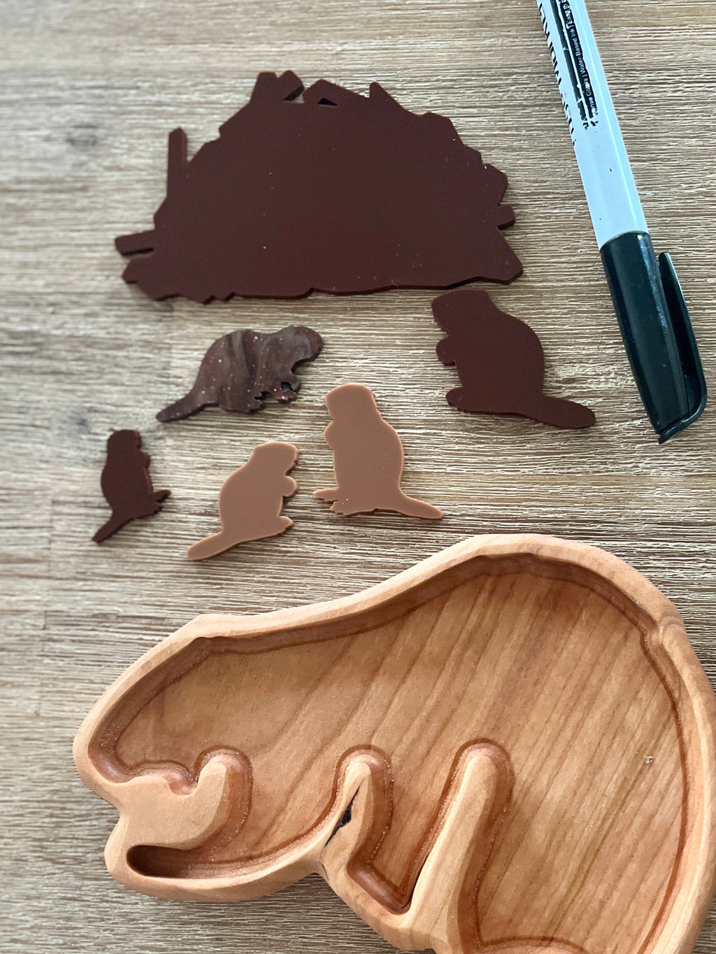 Little Dry Erasables - Beavers with Dam featuring handcrafted wooden beaver and dam shapes in various brown tones, displayed with a wood tray and a black dry erase marker, homeschool education resources.