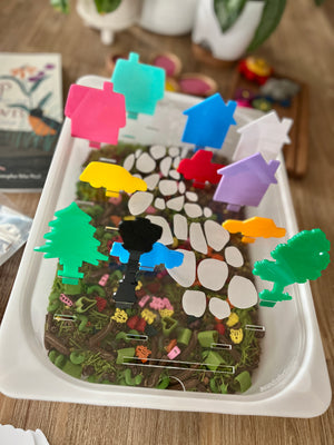 White tray featuring a nature-inspired insert with colorful translucent acrylic pegs shaped like houses, trees, cars, and street lamps, showcasing STEM Insert – Acrylic Insert with Different Peg Options - Neighborhood, Veggie Garden, Flower Garden, Under the Sea + More, handcrafted, homeschool, education resources.