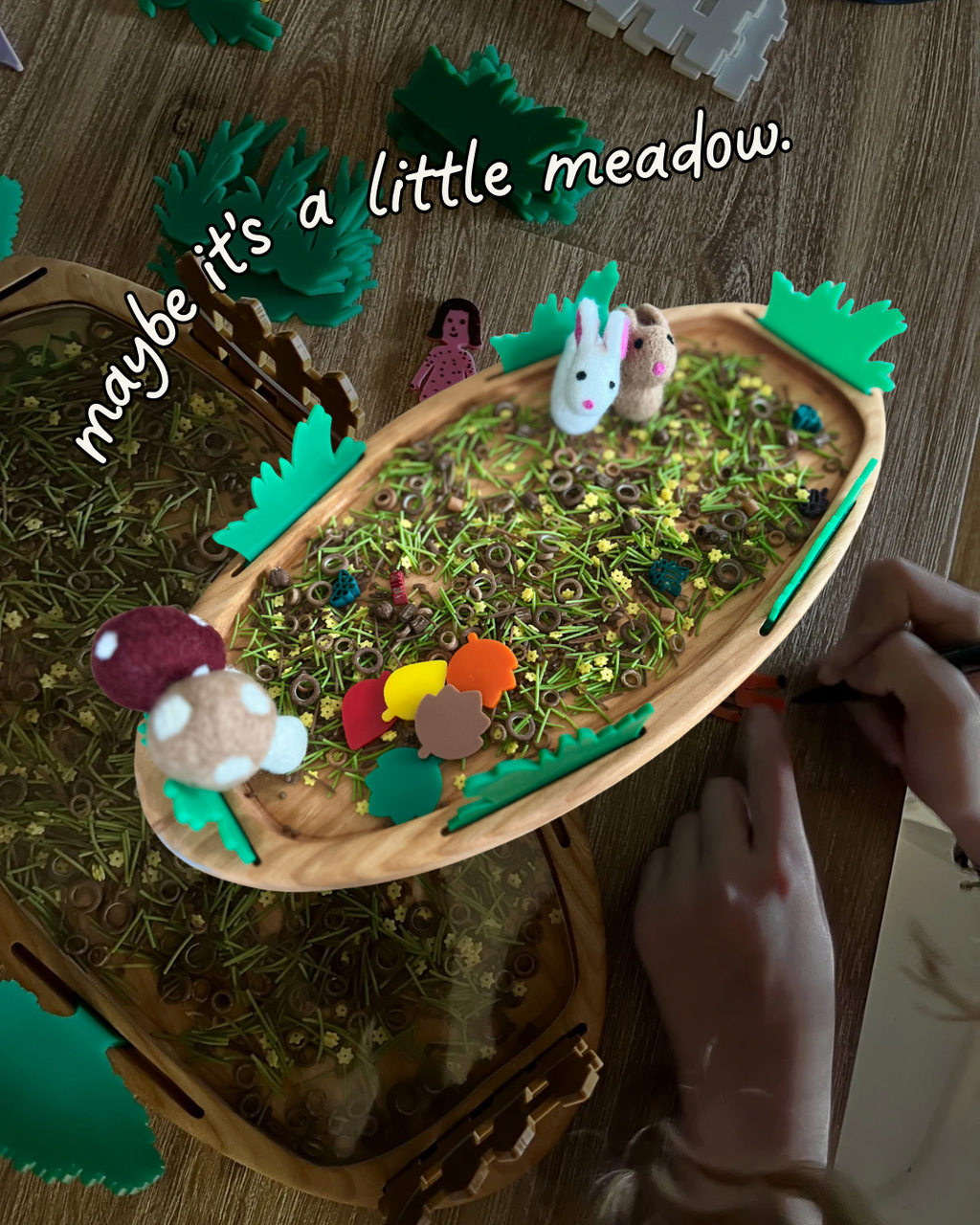 Multipurpose Oval Sensory Tray featuring wooden tray with green textured fillers, small felt animals, colorful wooden shapes, and handcrafted elements for homeschool education resources.