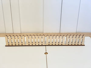 Wooden freestanding play fences with picket design on white surface for imaginative and sensory play