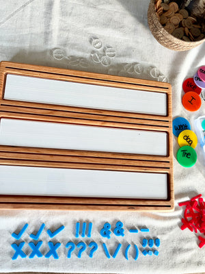 Little Dry Erasables - Mini Punctuation and Loose Parts 26 Pieces featuring handcrafted wooden trays with white dry-erase panels, vibrant blue punctuation marks, and colorful word discs, unique homeschool educational resources.