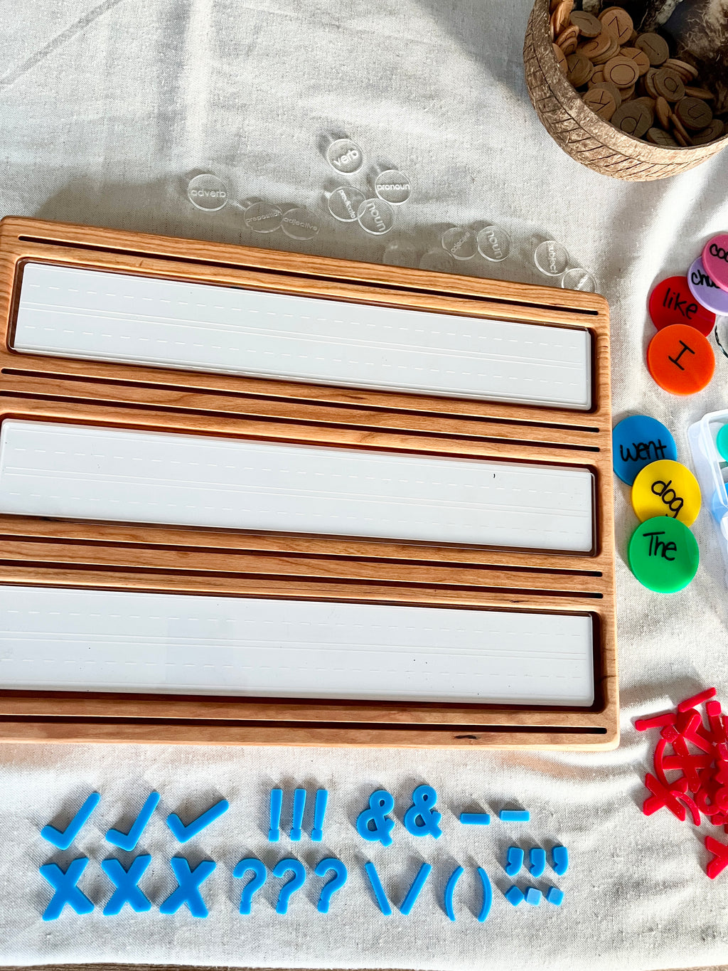 Little Dry Erasables - Mini Punctuation and Loose Parts 26 Pieces featuring handcrafted wooden trays with white dry-erase panels, vibrant blue punctuation marks, and colorful word discs, unique homeschool educational resources.