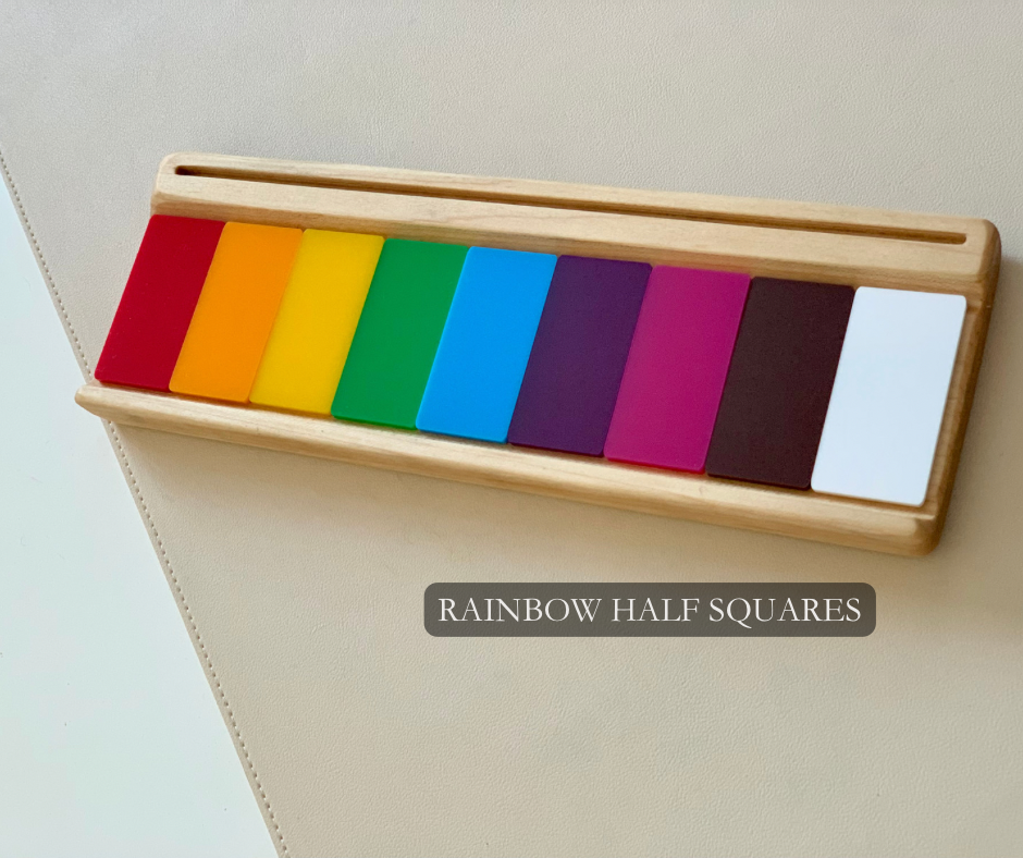 Wooden holder displaying nine colorful half-square tiles in a rainbow gradient from red to white on light surface