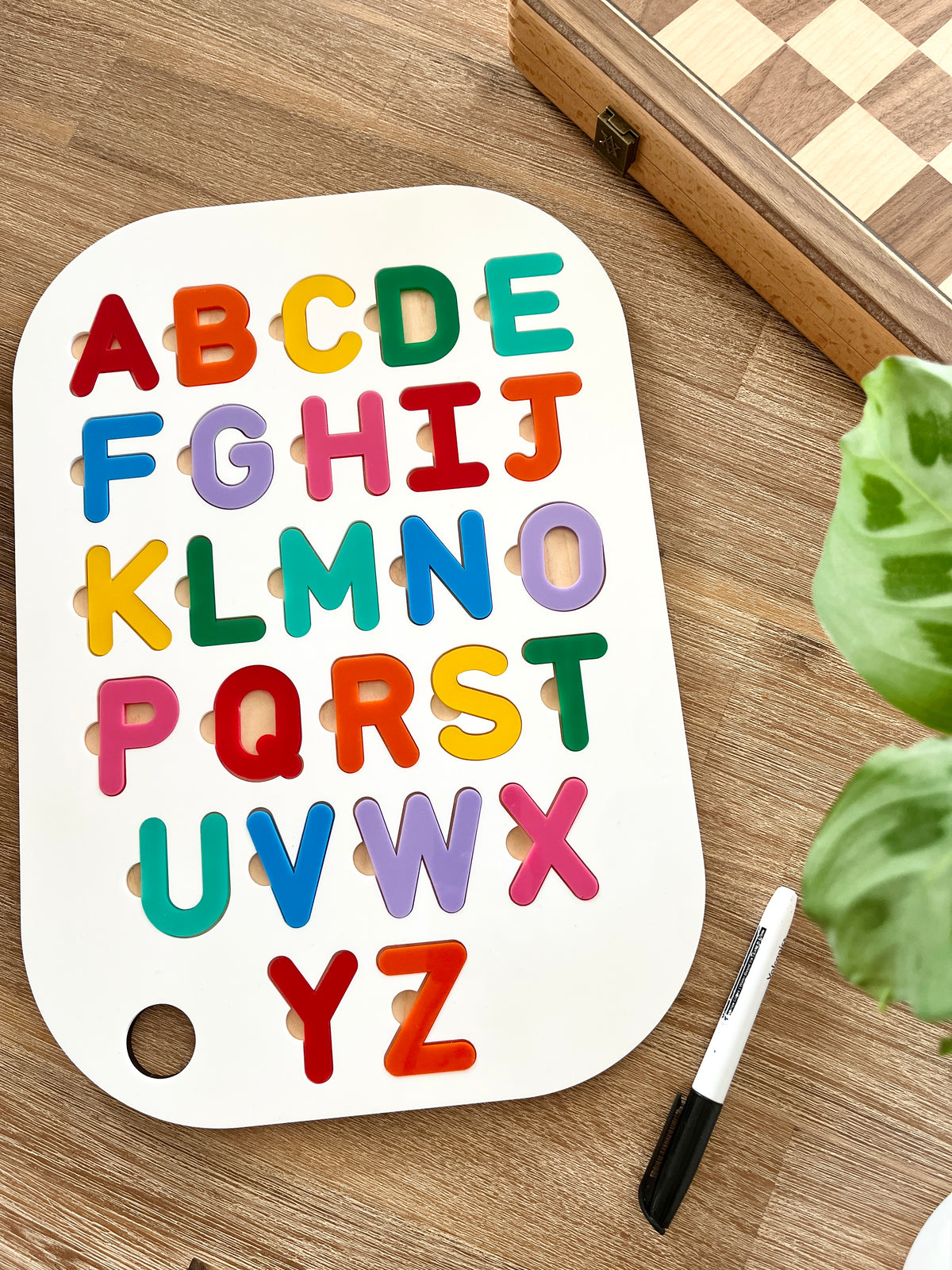 Acrylic Dry Erase Uppercase Alphabet Puzzle Flisat Table Top Insert with Both Rainbow and White Letters featuring colorful wooden letters on white base with black dry erase marker, handcrafted homeschool education resources.