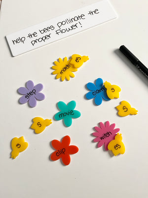 Little Dry Erasables - Pollinators - Bees & Flowers showing colorful flower shapes paired with yellow bee cutouts labeled with word parts and a dry erase marker on a white surface, handcrafted homeschool education resources.