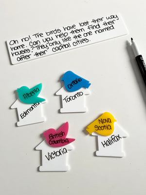 Little Dry Erasables - Birds & Houses displaying colorful bird-shaped pieces in teal, blue, pink, and yellow paired with white house shapes labeled with Canadian provinces and capitals, black dry-erase marker, handcrafted homeschool education resources.