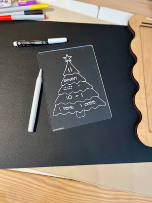 Clear plastic learning board shaped like a Christmas tree showing number eleven with tens, ones, addition, and Braille labels on black mat