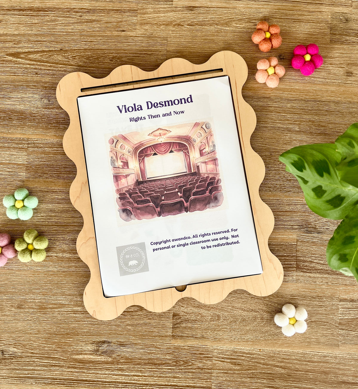 Digital Download | Viola Desmond Mini Study displayed on a scalloped wooden tray surrounded by colorful felt flowers and a green plant leaf, handcrafted homeschool education resources.