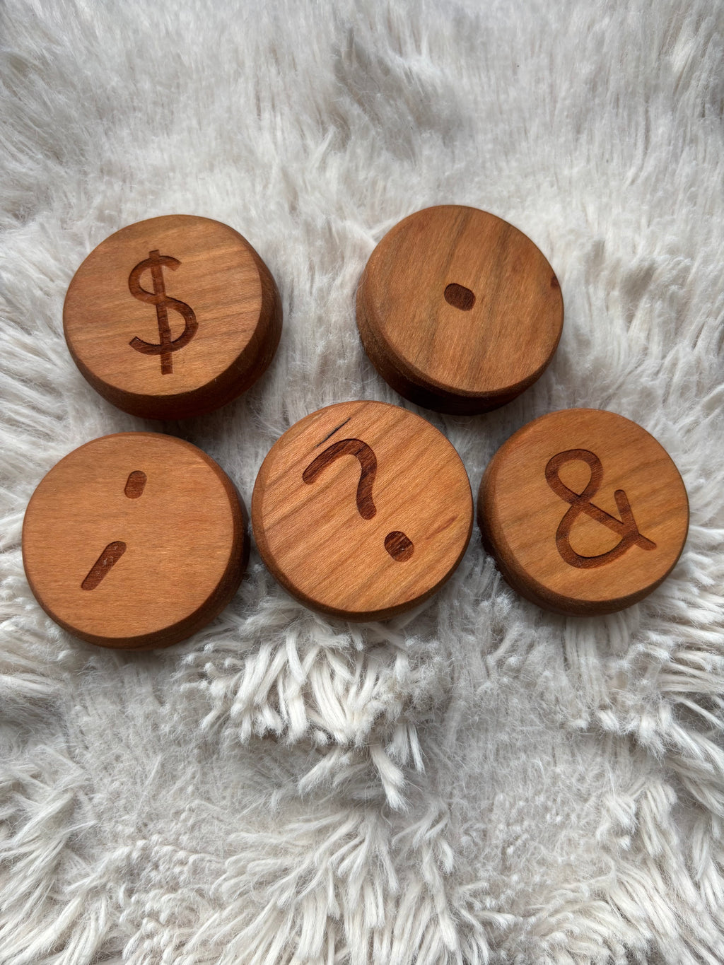 Ready to Ship, Playdough Stampers Punctuation featuring smooth handcrafted wooden discs engraved with punctuation marks including dollar sign, semicolon, question mark, period, and ampersand, unique homeschool education resources and wood toys.