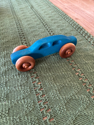 Ready to Ship, Push Cars, 10 Colours / Styles showcasing a handcrafted blue wooden toy car with smooth natural wood wheels, crafted as unique homeschool educational resources and wood toys.